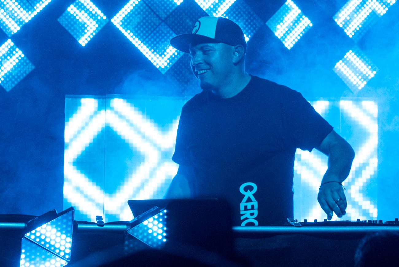 DJ Overcomer smiling at audience at Prophet Bar