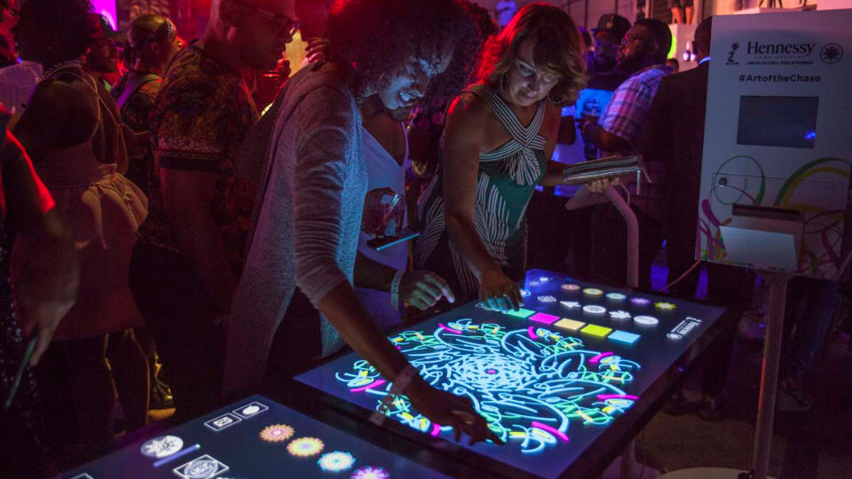 guests drawing on the touch screen at Hennessy 250th 